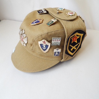 Vintage Russian hat with 17 badges